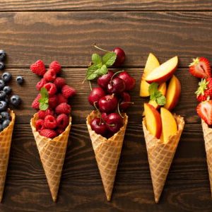 Fresh fruit and berries in waffle cones